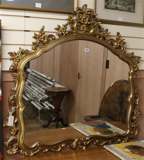 A rococo gilt wall mirror W.120cm